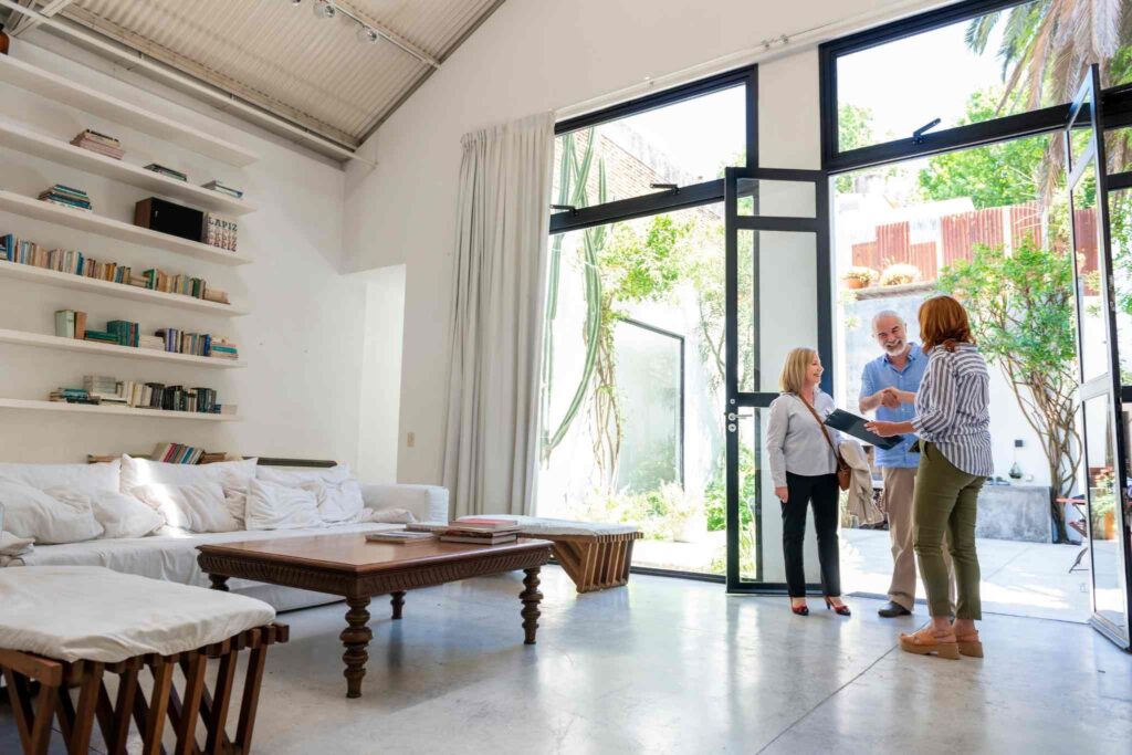 Couple talking to real state agent
